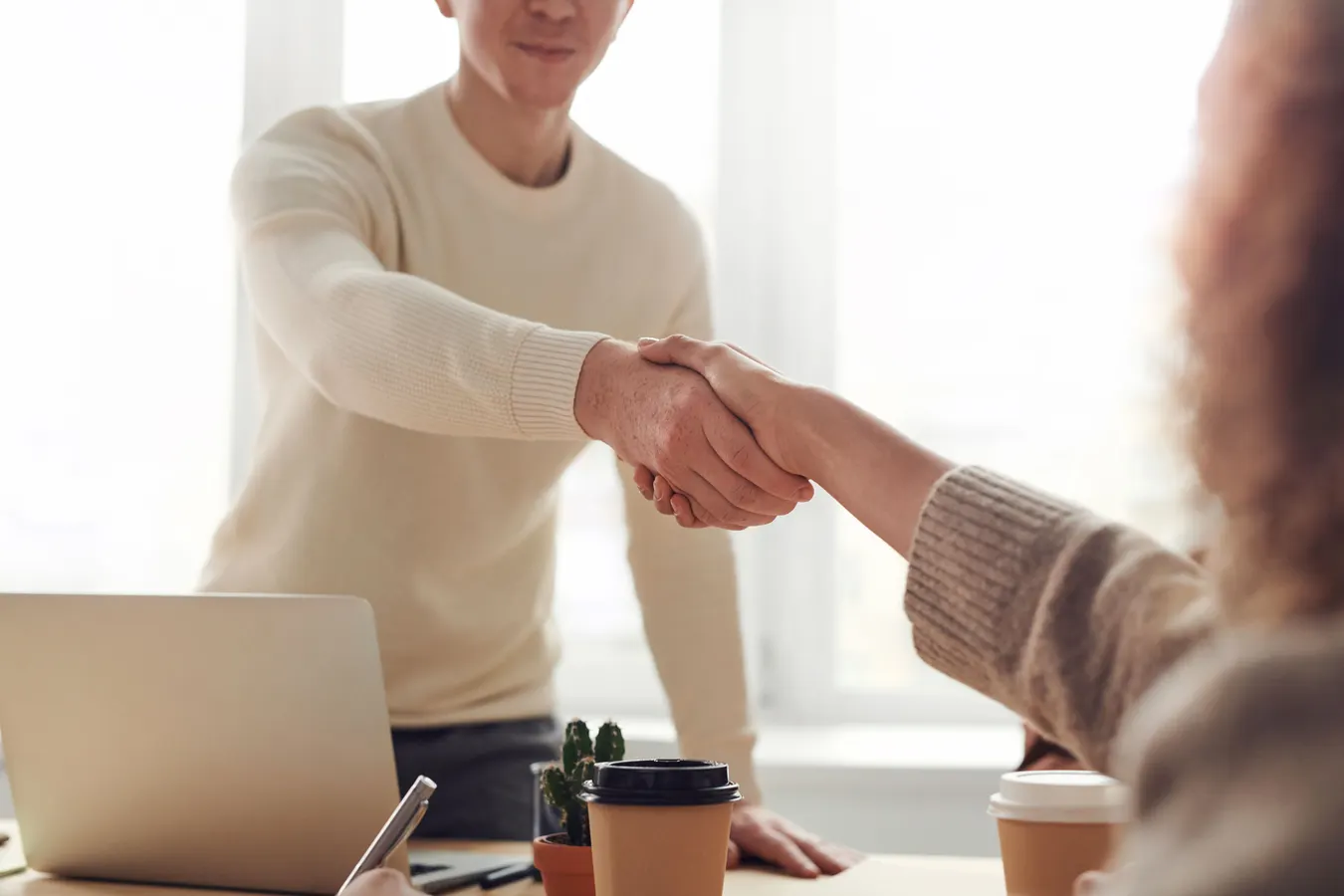 Small business owner reviewing a digital marketing checklist with SEO, website, and customer growth analytics