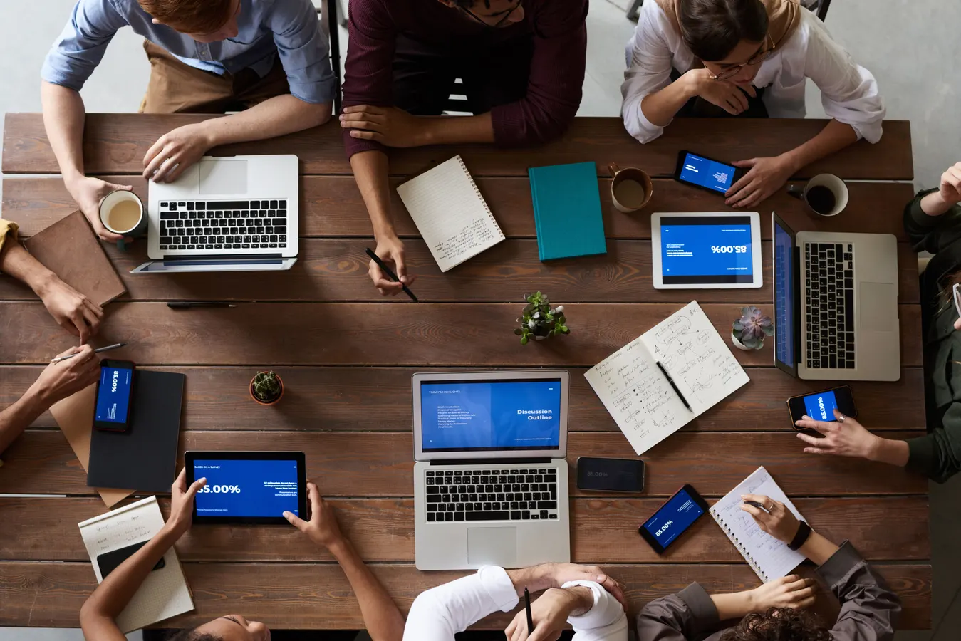 Small business owner reviewing digital marketing growth strategy with laptop and analytics dashboard