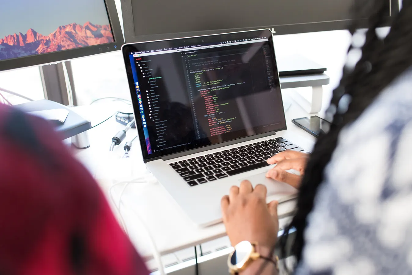 Small business owner analyzing website SEO performance and Google search rankings on a computer